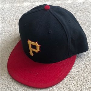 A used New Era Pittsburgh Pirates hat size 7 3/8.